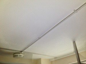 Textured ceiling coating containing asbestos